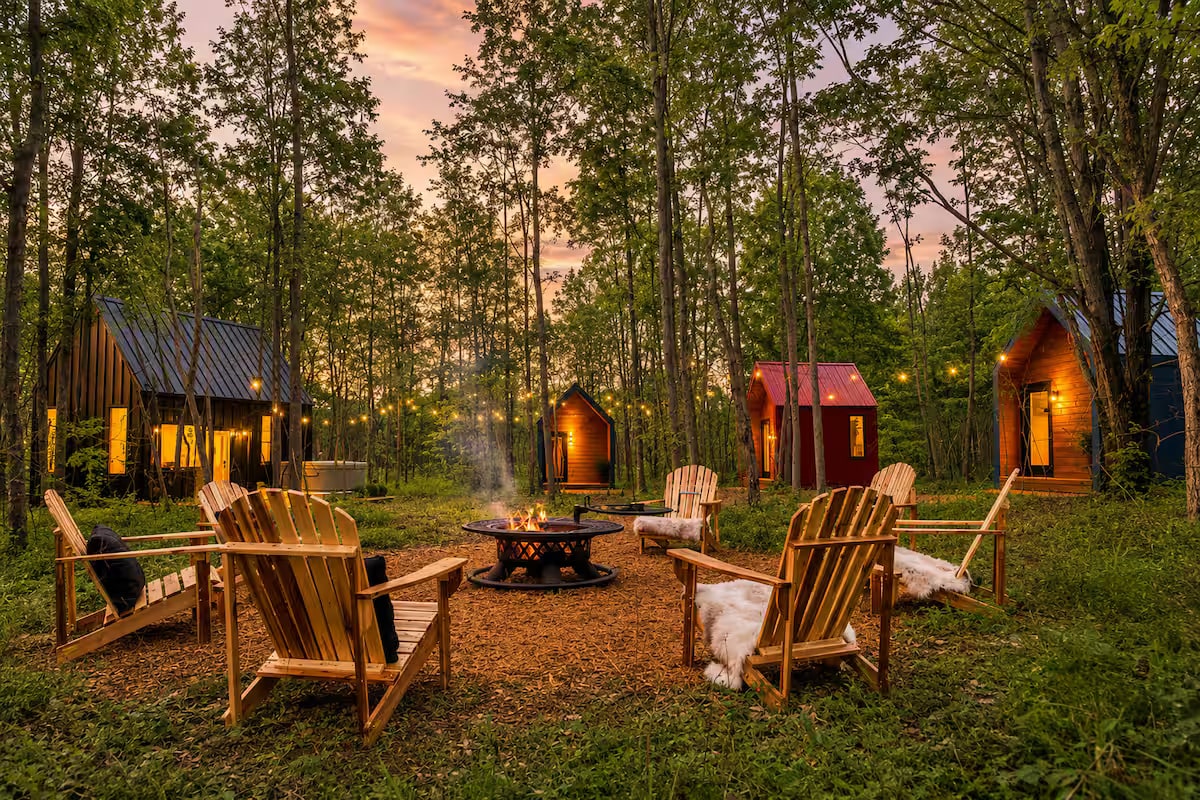 Cabins set in a woodland clearing at Nordic Pines