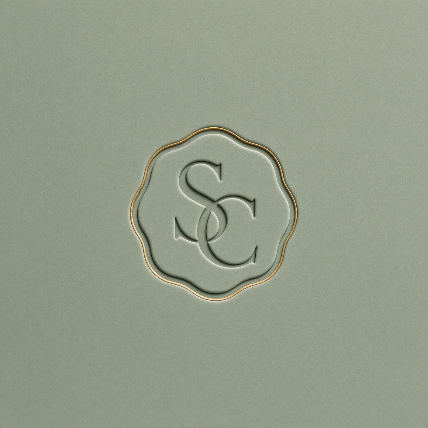 Stay Canvas intertwined SC monogram embossed in sage with a gold border